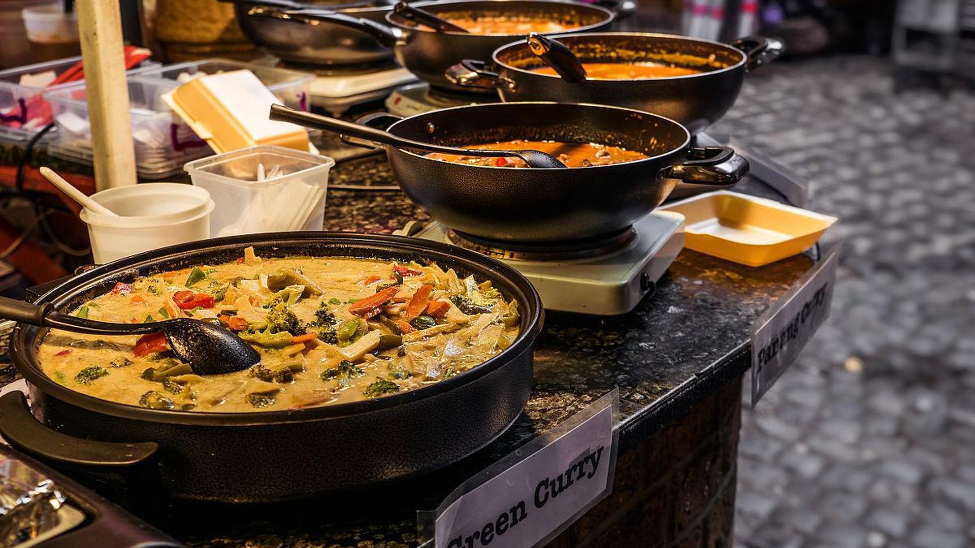 hotpot meal in Chengdu with steaming pot, chili oil, and fresh ingredients on table