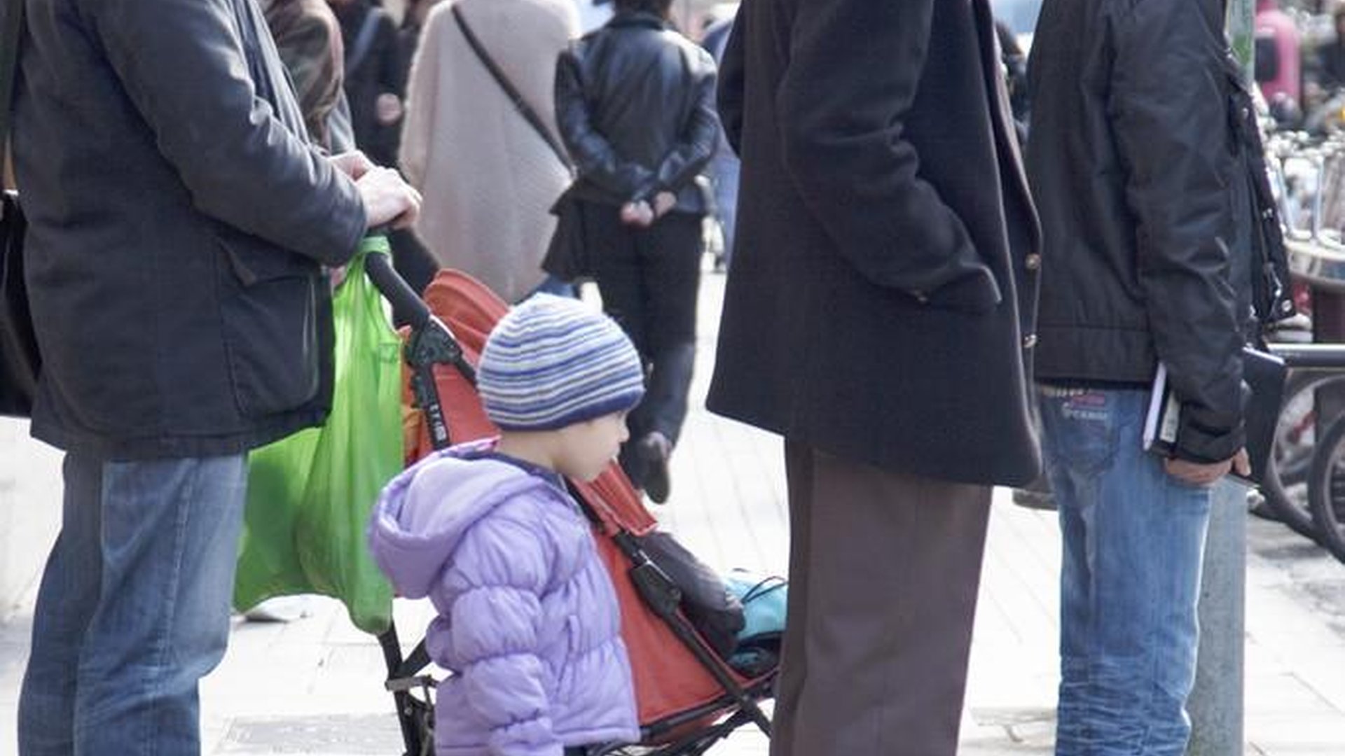 early morning street scene in China with old man selling steamed buns and golden sunrise