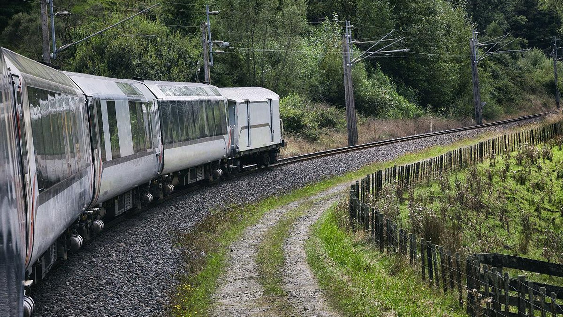 bullet train through guilin countryside, rice paddies, green hills, sunrise, scenic railway journey