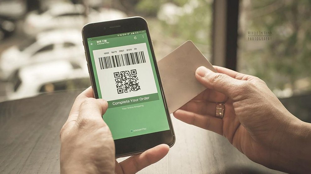 person using Alipay or WeChat Pay at small street vendor in Hangzhou, urban Chinese market, digital payment