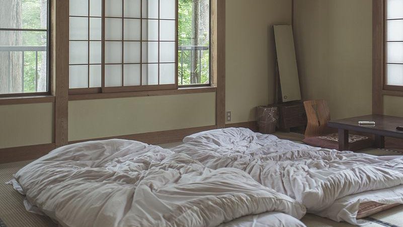 wooden floor room in a 19th-century Japanese house with tatami mats and traditional interior