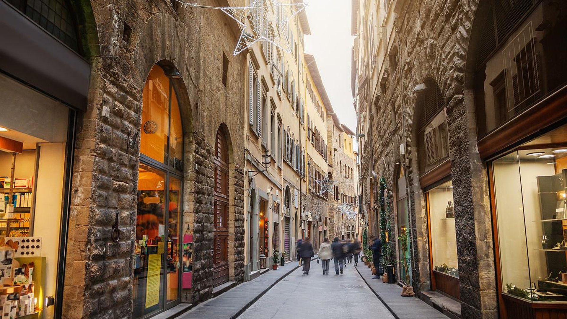 Florence cobblestone street golden hour late Septe